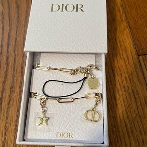 Dior phone charm.